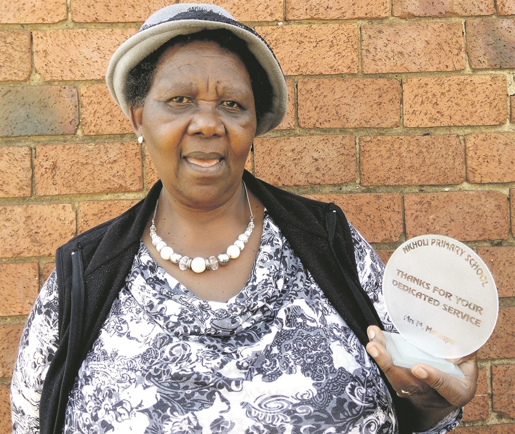 Maria Mohlape and her trophy she got for World Teachers’ Day a few years ago. Photo by    Kopano Monaheng