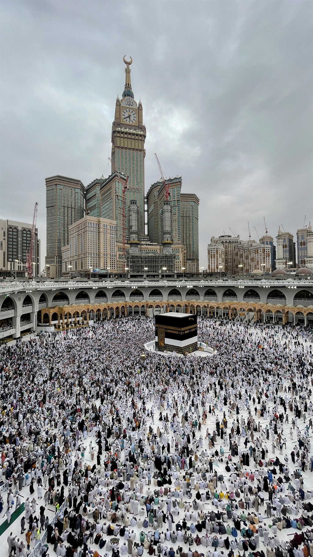 Muslim pilgrims circle the Kaaba as they pray at t