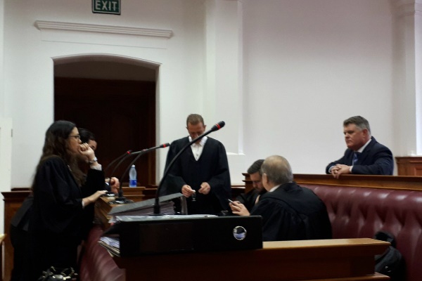 Legal huddle ahead of Jason Rohde's trial on charge of murder of his wife Susan at Spier wine farm last year. (Jenni Evans, News24)