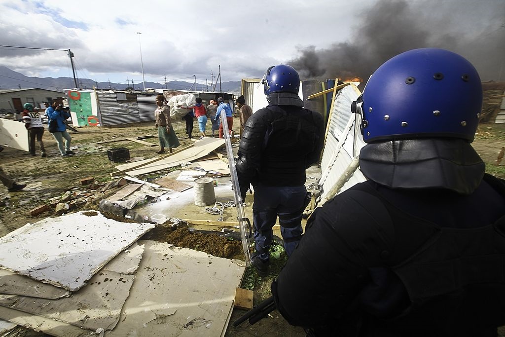 Police evict residents in Nomzamo Informal Settlement in Cape Town back in 2014.