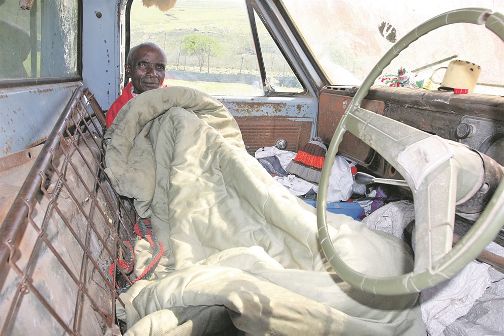Madala Bhistoli Mbelani sleeps in his battered vehicle. Photo by Mbulelo Sisulu
