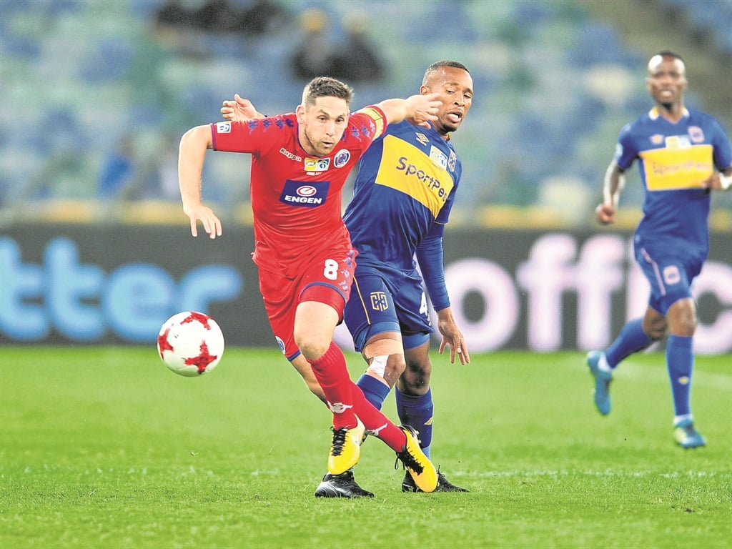HOT PURSUIT Dean Furman of SuperSport United is challenged by Lehlohonolo Majoro of Cape Town City during the MTN8 final at the Moses Mabhida Stadium yesterday. Pictures: Samuel Shivambu/BackpagePix