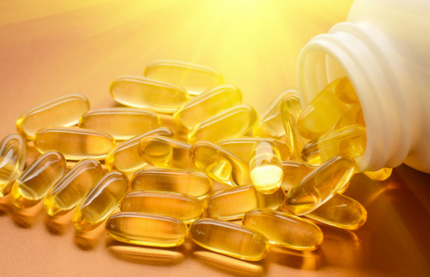 yellow gel capsules and bottle 
