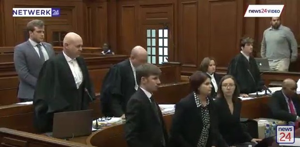 Court has adjourned for a "few seconds" as Botha says he needs to take instruction from client. Accused&nbsp;Henri van Breda can be seen wearing a grey suit.&nbsp; 