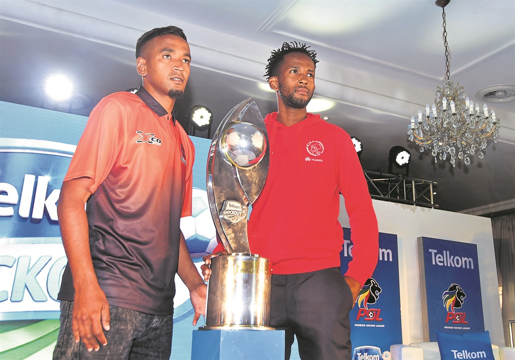 Mosa Lebusa, pictured posing with Nazier Jacobs of Polokwane City at the Telkom Knockout draw, reckons victory help boost morale among Ajax Cape Town’s squad. Photo by Lucky Morajane
