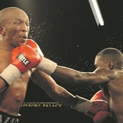 POW!  Simpiwe Vetyeka is caught by Lerato Dlamini’s left during their featherweight bout. (Lefty Shivambu, Gallo Images)