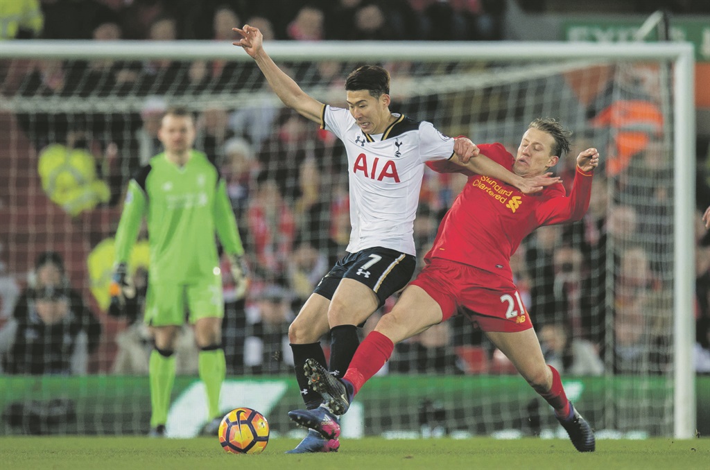 Retro:Tottenham Hotspur’s Son Heung-min (left) in action with Liverpool’s Lucas Levia in a match played earlier this year. The two English Premiership sides meet this afternoon. Picture: Miguel Tona / EPA