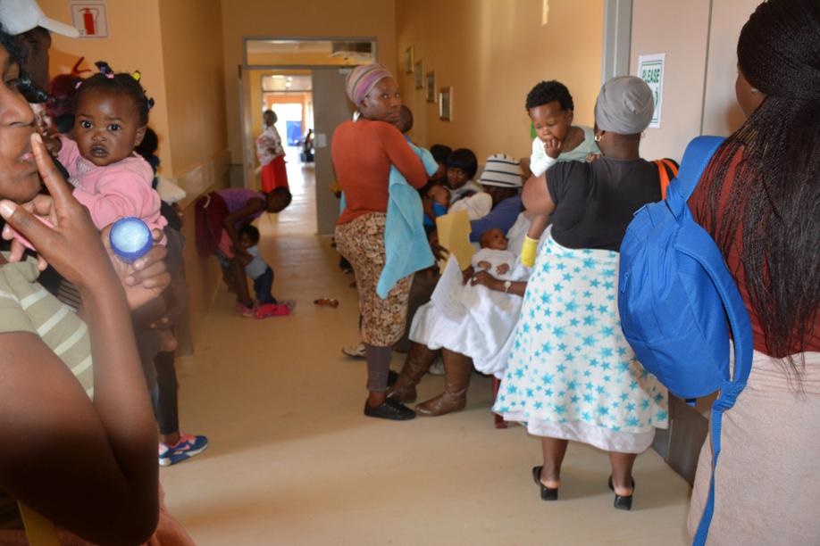 These mothers at Thembalethu Clinic say they are tired of being made to wait for a long time to get their children vaccinated. Photo by Bongani Mthimunye