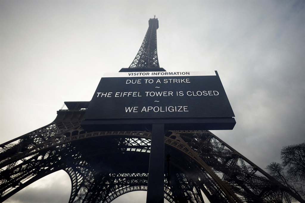 A sign reading Due to a strike, the Eiffel Tower i