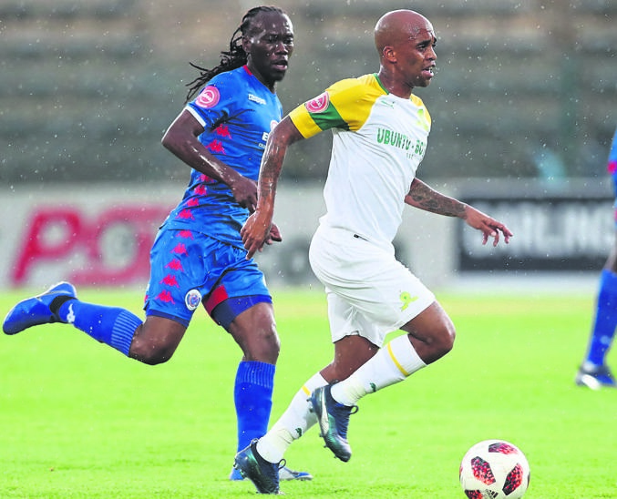 Oupa Manyisa of Sundowns (right) gets away from SuperSport’s Reneilwe Letsholonyane during their football match yesterday.Photo byGavin Barker/BackpagePix