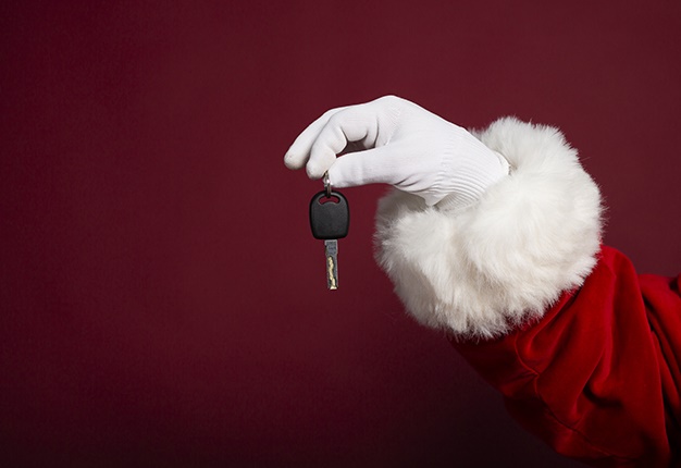 Santa Claus holding car keys