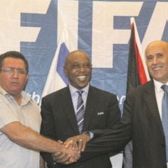 JUST A GESTURE:  Tokyo Sexwale with IFA president General Ofer Eini and PFA president General Jibril Rajoub. (Supplied)