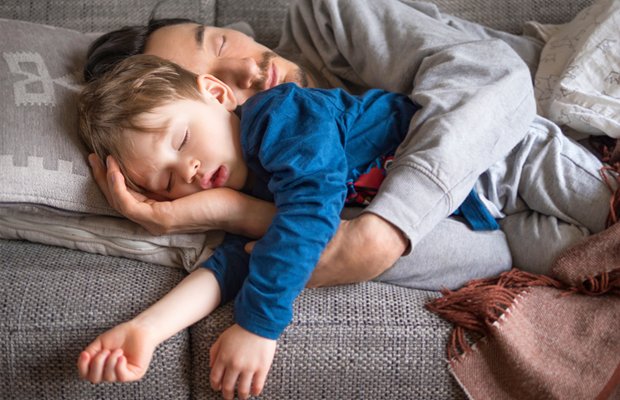 child and dad napping