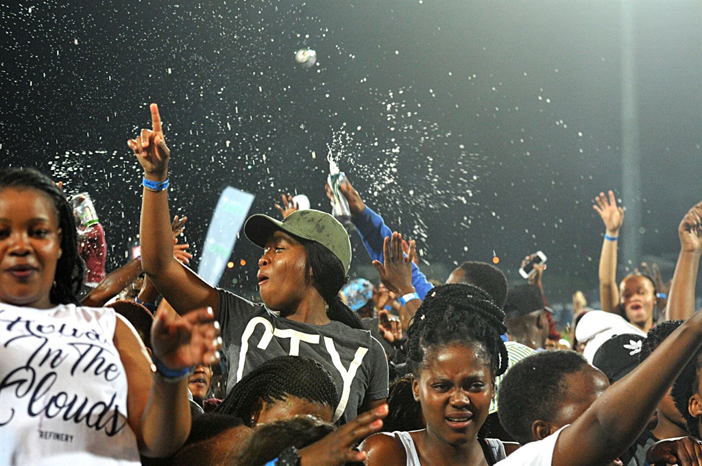 Young women boozing and irrigating each other with booze during Ink Hop festival held at Princess Magogo stadium KwaMashu. Photo by Jabulani Langa