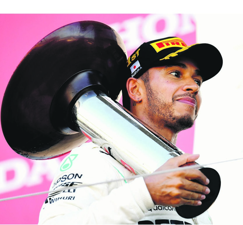 Champ Mercedes GP driver Lewis Hamilton has become a common sight on the winner’s podium   PHOTO: Clive Mason / Getty Images
