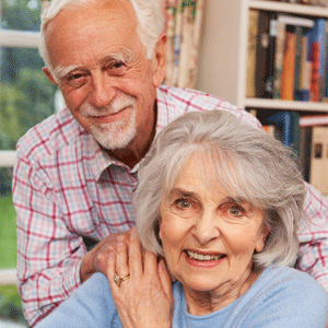 Older couple holding on