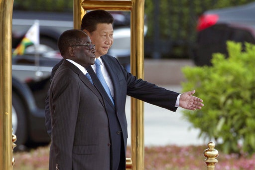 <p>Chinese President Xi Jinping, right, shows Zimbabwe's
President Robert Mugabe the way during a welcome ceremony outside the Great
Hall of the People in Beijing, China. 

&nbsp;
</p><p>Under Robert Mugabe’s decades-long rule over Zimbabwe, China
grew into one of its biggest investors, trading partners and diplomatic allies.


&nbsp;

</p><p>Now, as the African nation appears on the verge of its first
transition of power since independence, Beijing is poised to be among the
biggest winners. (Ng Han Guan, AP, File)

</p>