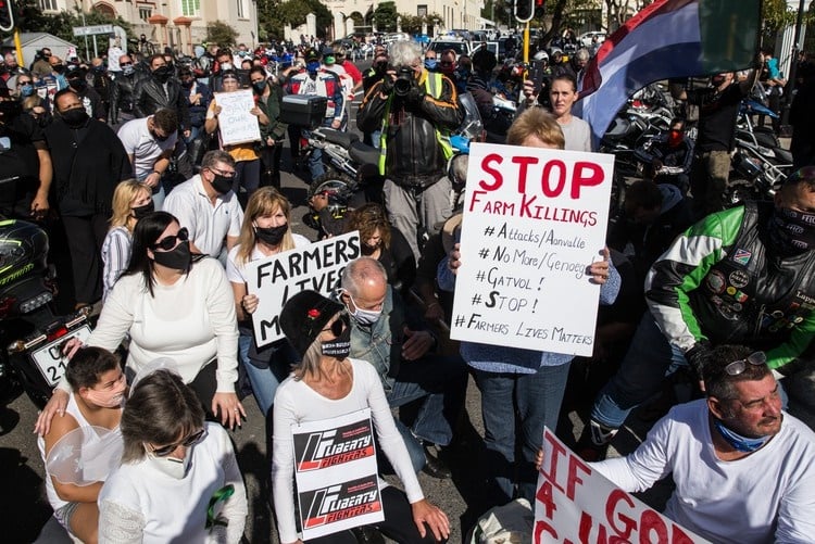 Hundreds of people, many on bikes, protested outside Parliament on 18 June against farm murders.