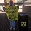 Activists simulate nuclear disaster outside environmental affairs department