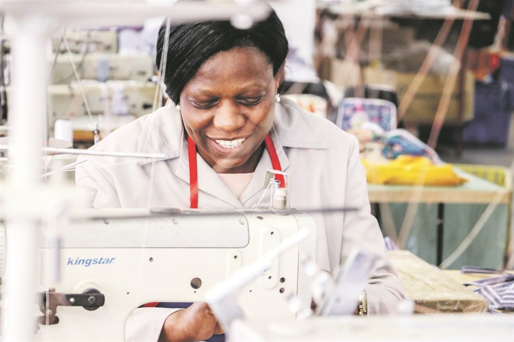 Sindi Ndlovu, a dress maker, sews clothes at the Exodus by Huyu Houz factory in Doornfontein. Workers should be celebrating the national minimum wage, but there are many ways companies can avoid paying   Picture :Livhuwani Mutele