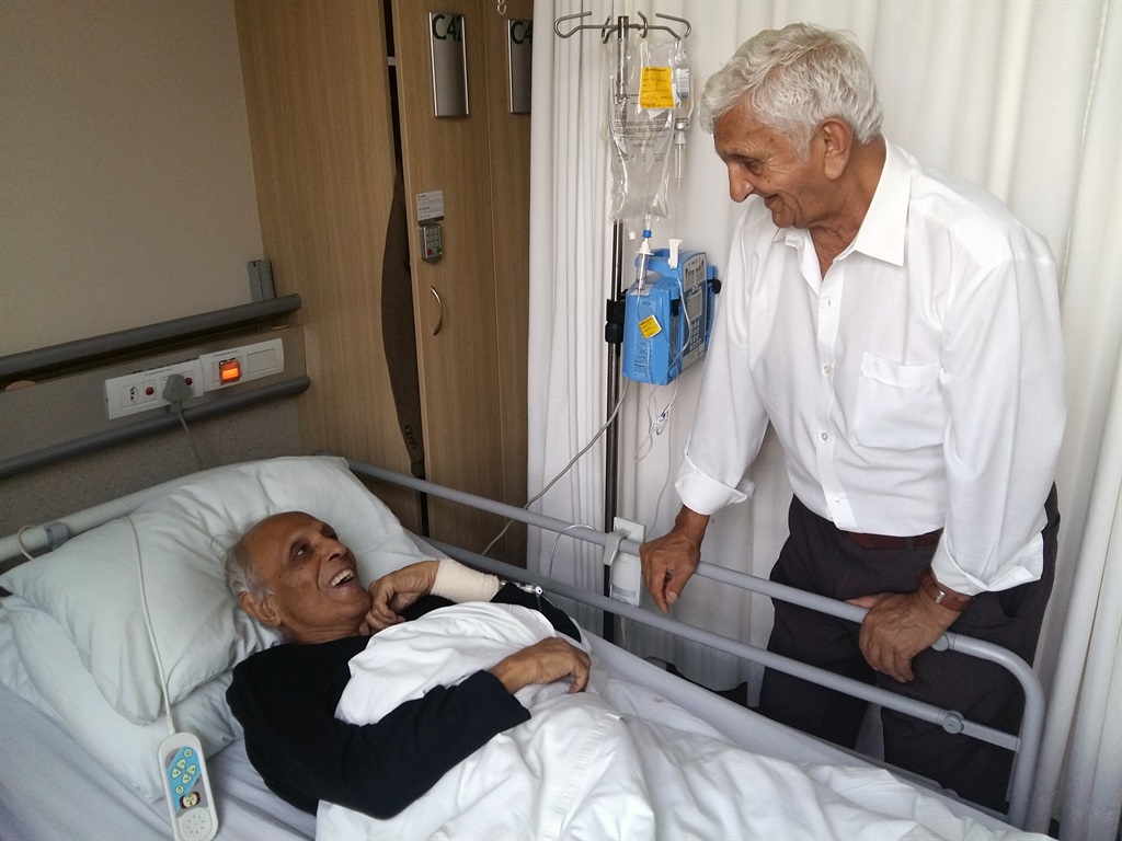 Ahmed Kathrada and fellow Robben Island prisoner, Laloo Chiba, sharing a humorous moment at the hospital just before the surgery. Picture: Supplied