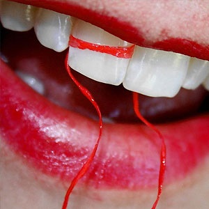 Teeth, floss and lipstick. Source: Photographer, D. Sharon Pruitt Owner of Pink Sherbet Photography via Wikimedia Commons