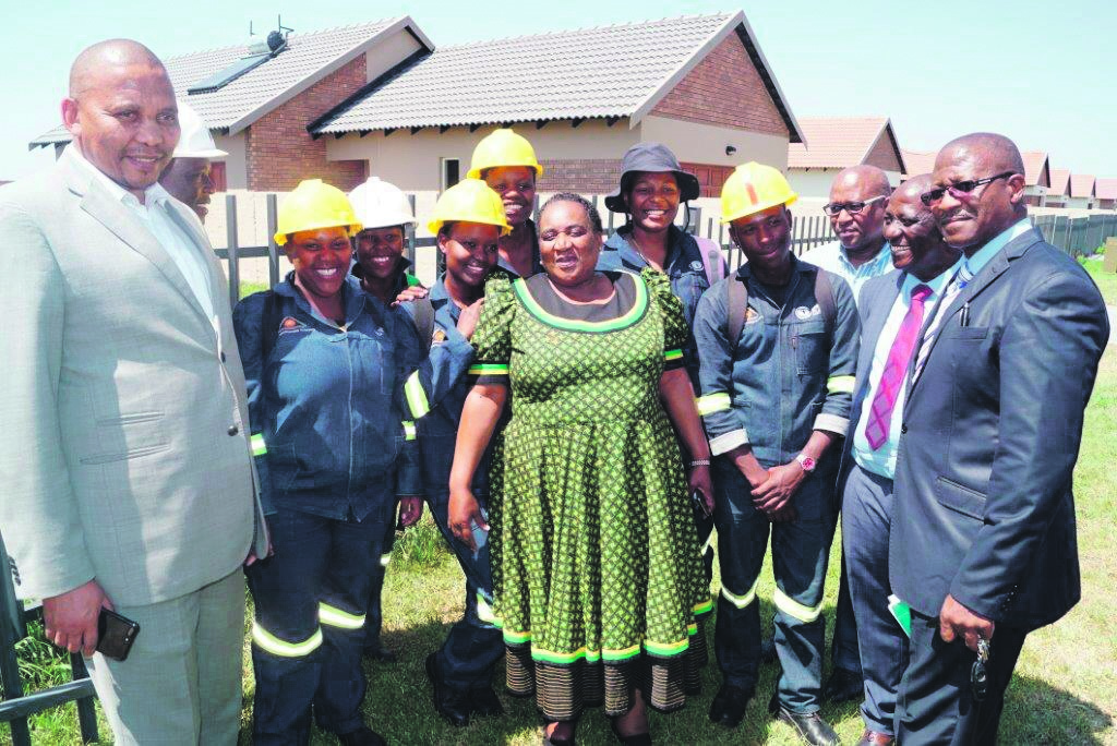 Building the future: From left to right: Labour Deputy Minister Phatekile Holomisa, Minister Mildred Oliphant, UIF Board member Thulani Mthalane, Royal Bafokeng Platinum MD for Housing & People Management, Collin Alexander and Chief Director: Provincial Operations, Department of Labour Andile Makapela with construction workers. Picture: UIF.