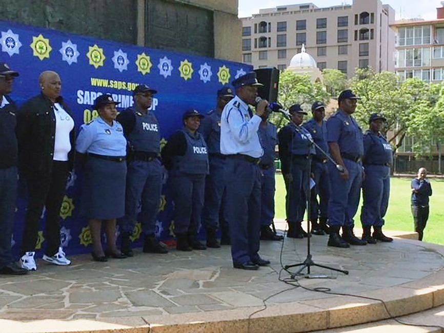 Police commissioner General Khehla Sitole (centre) urged cops to stay safe this festive season.