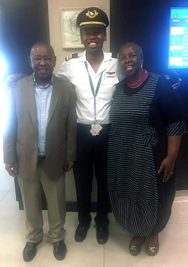 Proud parents Blade and his wife Phumelele Ntombela-Nzimande with their pilot son Lunga (middle). Photo: Facebook