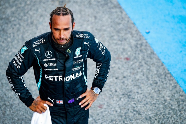 Race winner Lewis Hamilton of Great Britain and Mercedes GP looks on.