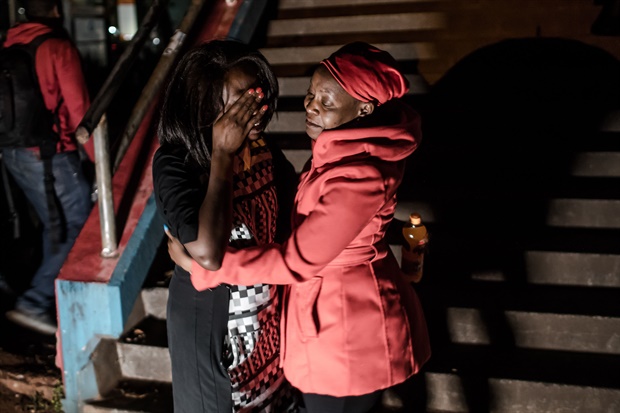 A woman reacts as she is reunited with family after being
evacuated from the DusitD2 compound in Nairobi after a blast followed by a gun
battle rocked the upmarket hotel complex. (<strong>Picture: AFP)</strong>

