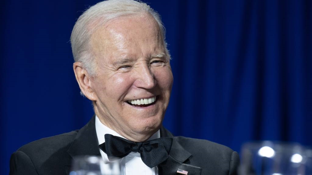 US President Joe Biden laughs during the White Hou