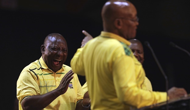 Cyril Ramaphosa in the background laughs at President Jacob Zuma at the start of the African National Congress elective conference in Johannesburg. (Themba Hadebe/AP)

