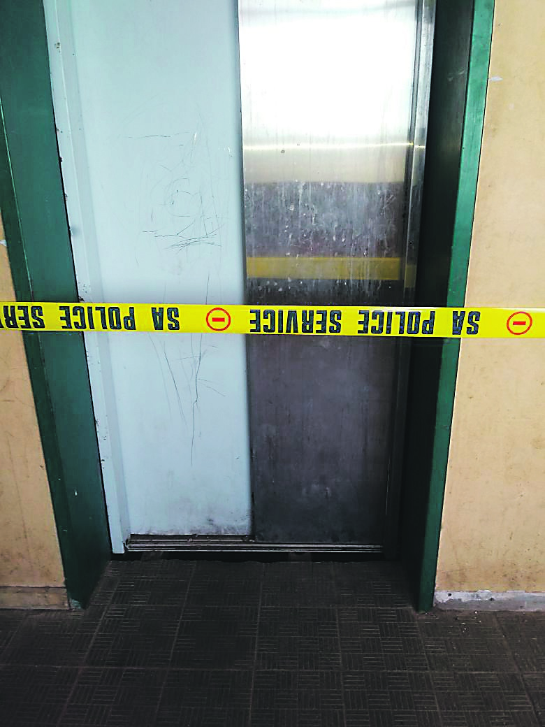 This door of a broken lift opened when the six-year-old girl leaned against it on Sunday.