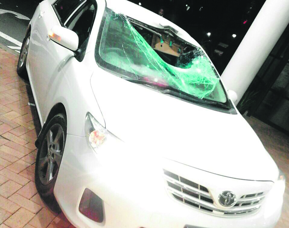 The damaged windscreen of the car that was hit by a rock.