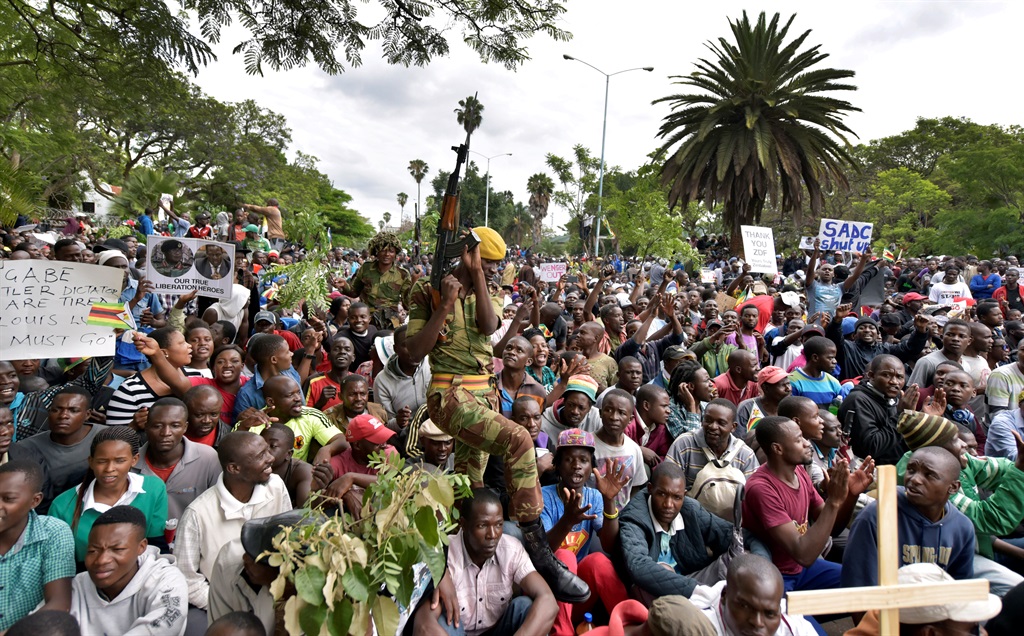 The army keeps watch as Zimbabweans gather in Harare to demand that Robert Mugabe resign as president. Picture: Felix Dlangamandla/Netwerk24