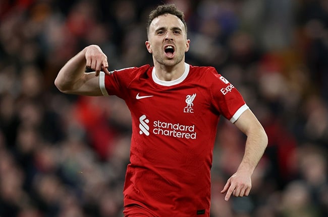 Liverpool's Diogo Jota celebrates scoring his team's first goal during the Premier League match against Chelsea at Anfield on 31 January 2024. (Photo by Clive Brunskill/Getty Images)