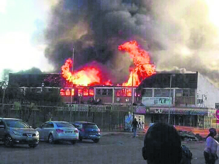 Angry residents torched houses occupied by foreigners in Rustenburg on Wednesday.        Photo by Rapula Mancai