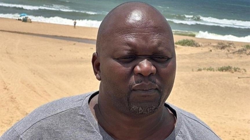 Snikokuhle Ncube’s father, Bishop Ncube at the beach waiting for his son’s body to wash up. 