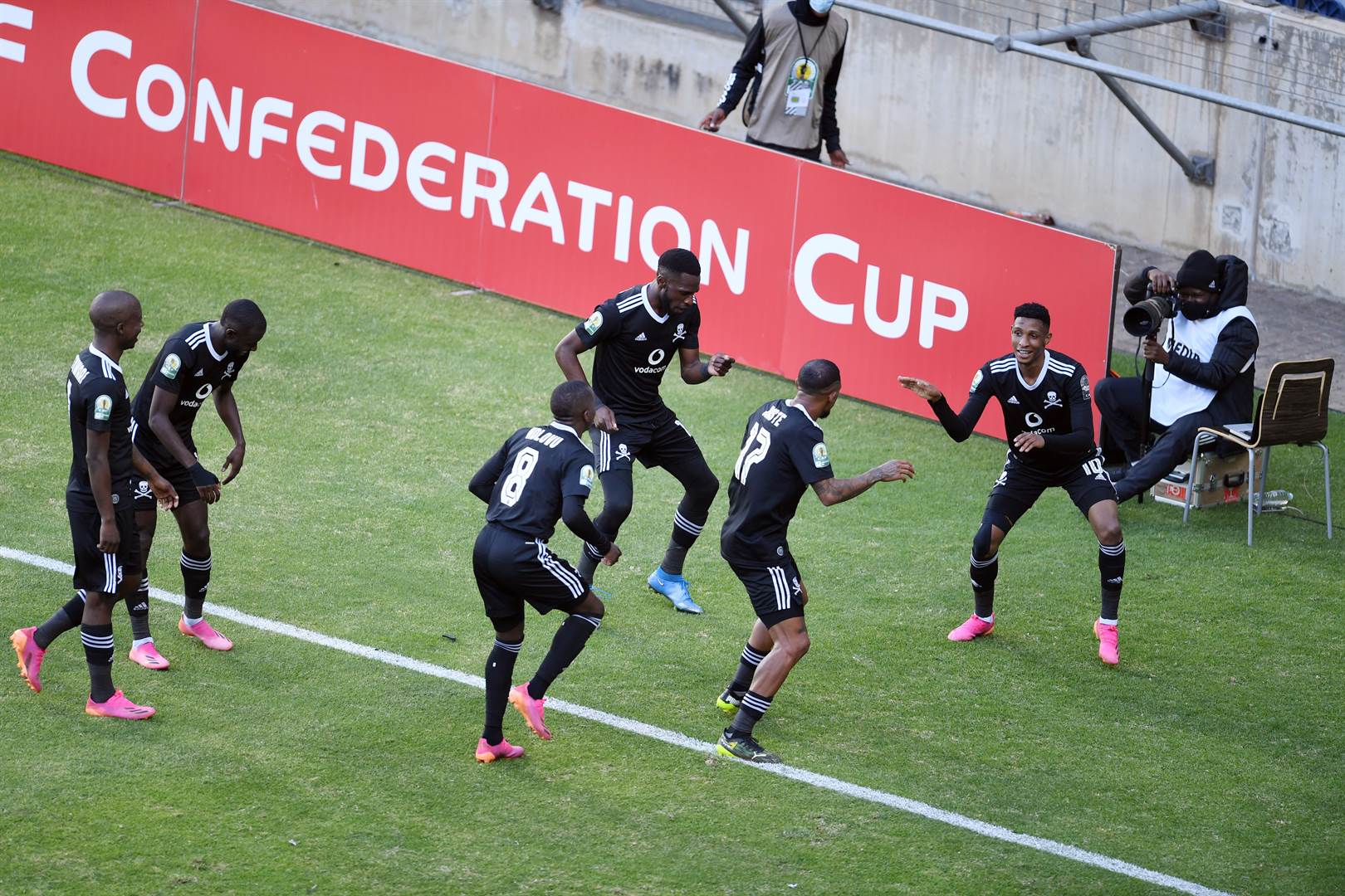 Orlando Pirates players celebrate after taking the