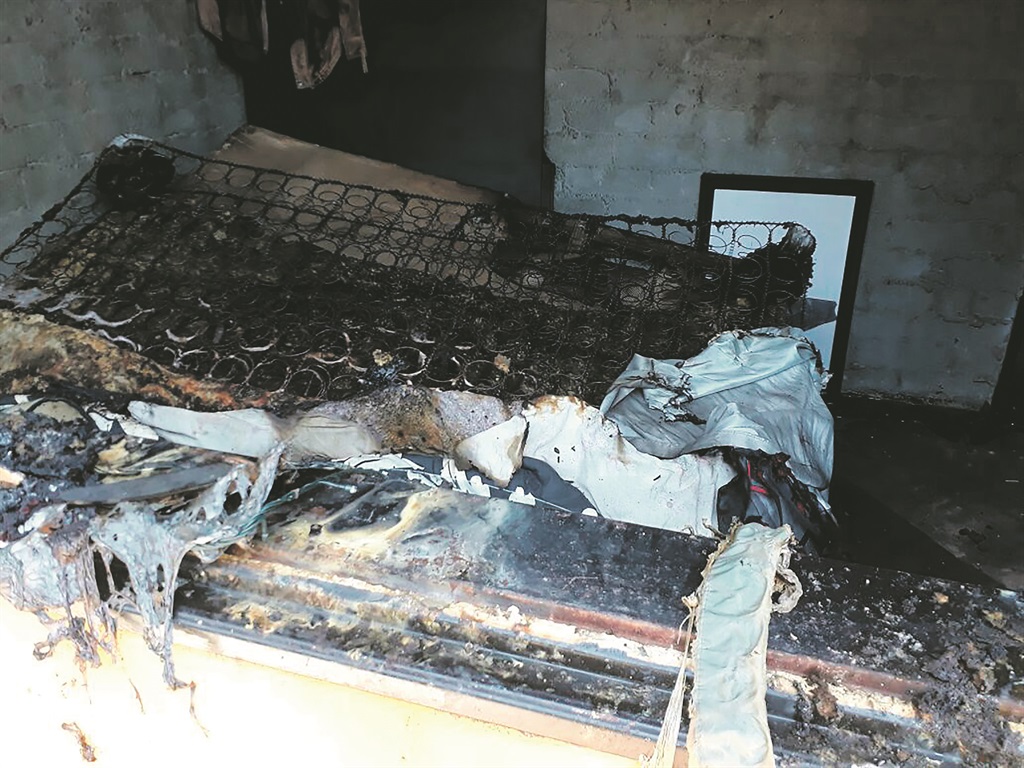 The charred remains of the family home where Nosiphiwo Williams and her siblings were sleeping when it was set on fire.