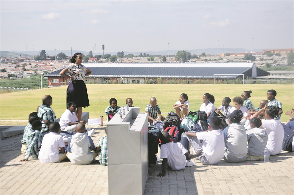 A teacher and pupils at a Future Nation School orientation class.        Photo by Thabo Monama