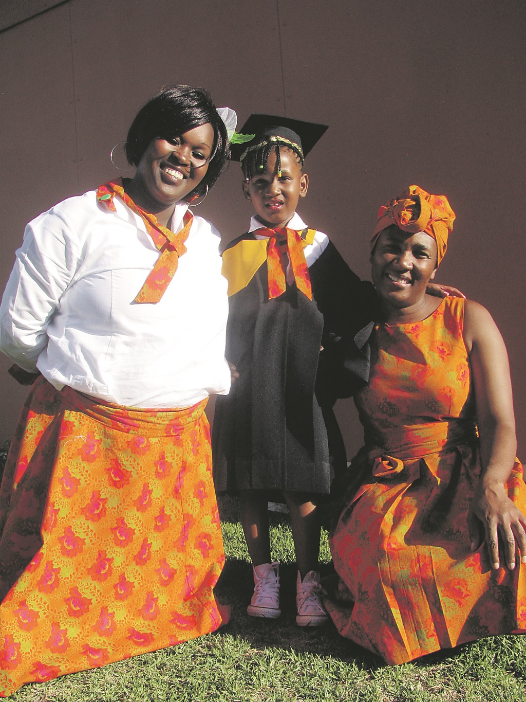 Left: Connie Lebogo and her daughter Boitumelo who graduated from Asha in Klipspruit, with Boitumelo’s teacher, Busi.                        Photo by Kopano Monaheng