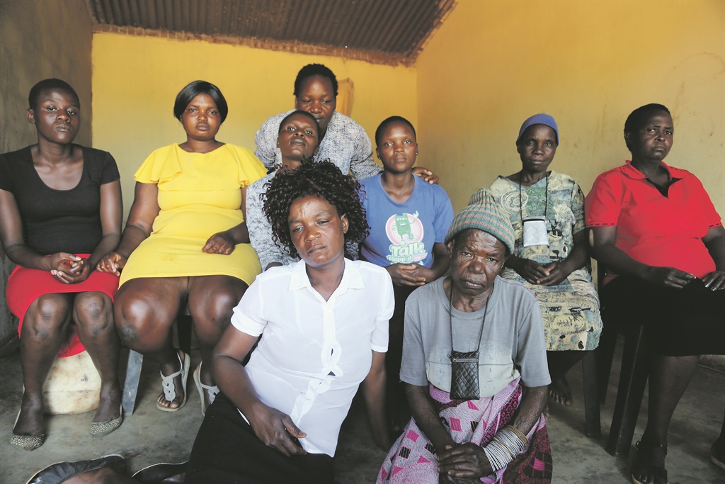Front left: Grace Muridili’s mum Tshifiwa, gogo Mungezi Neba and other family members say the exhumation has left them hurt but relieved.  Photo by Joshua Sebola