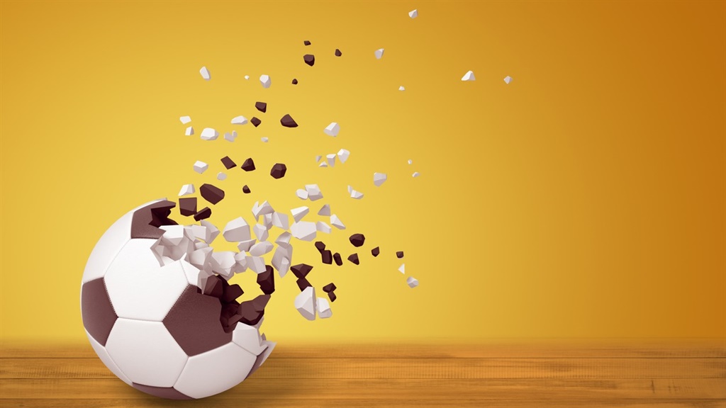 3d rendering of a football dissolving into particl
