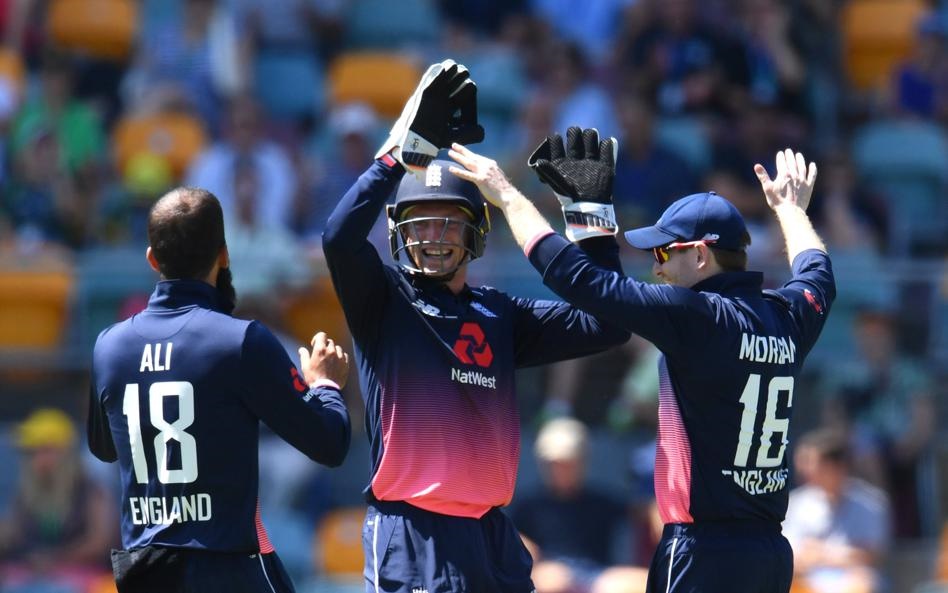 England celebrate a wicket during the second ODI in Brisbane. Picture: EPA/Darren