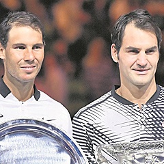 SIMPLY THE BEST: Rafael Nadal and Roger Federer pose with their trophies after their epic final in the Australian Open last year. (Kyodo News, Getty Images)