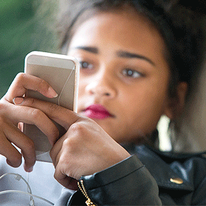 Teen on her mobile device 