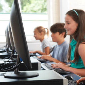 Group of primary-schools kids using the computer 