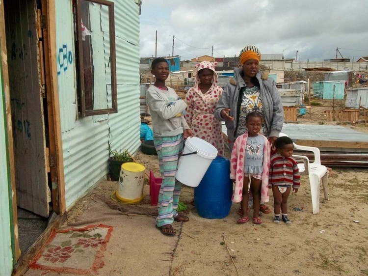 Nozakuthini Batyi and her children in Empolweni in